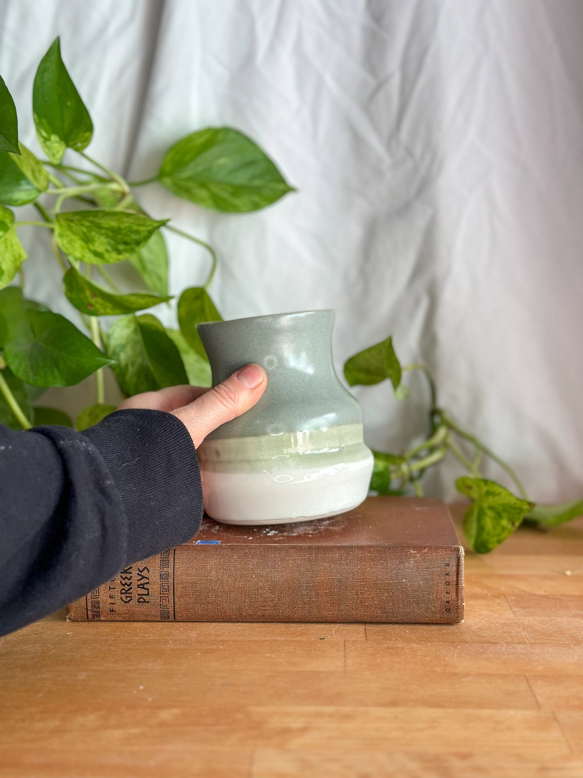 hand holding a bud vase handmade