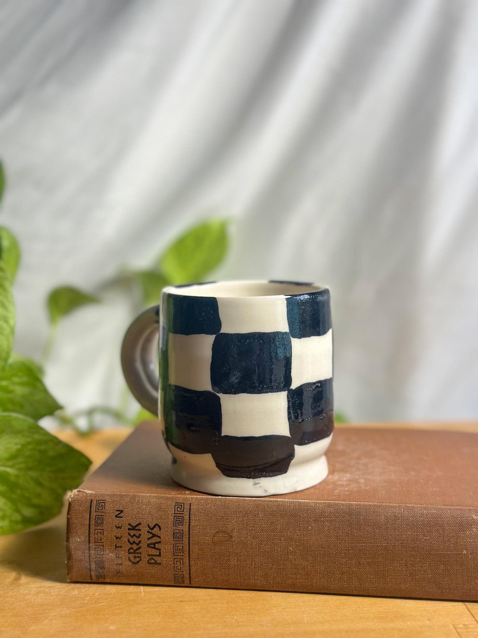 black and white checkered hand made pottery mug