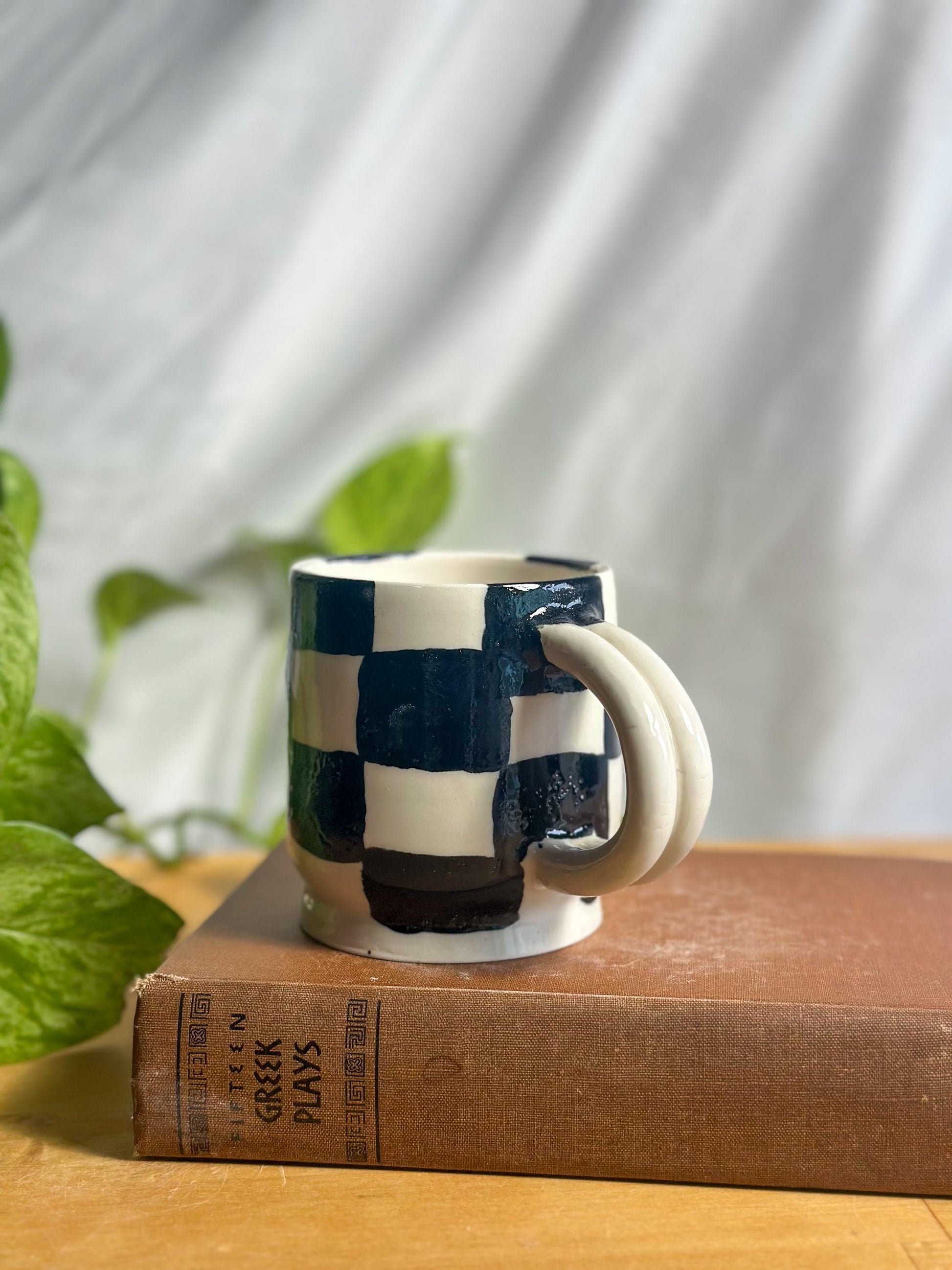 black and white checkered hand made pottery mug