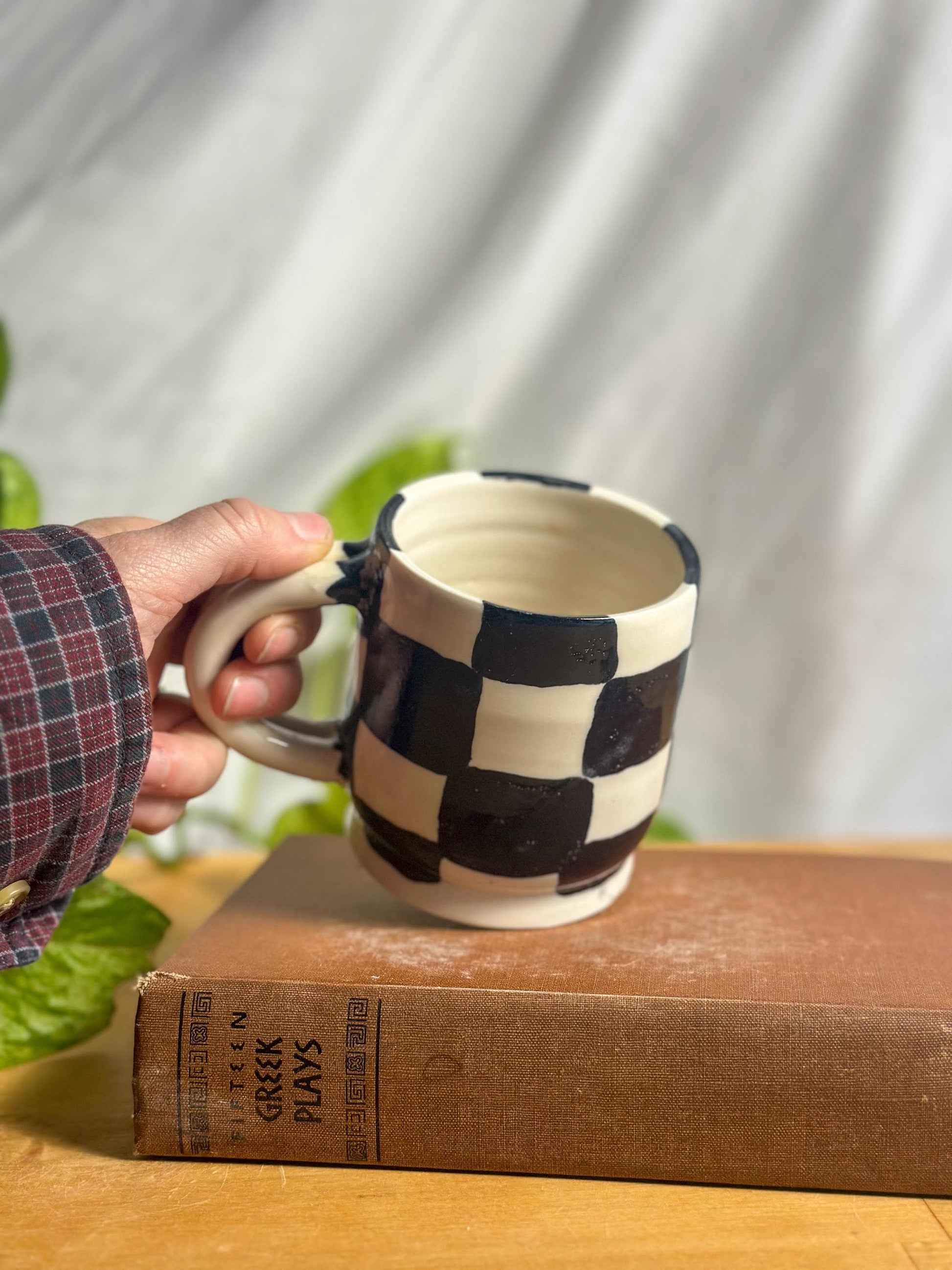 black and white checkered hand made pottery mug