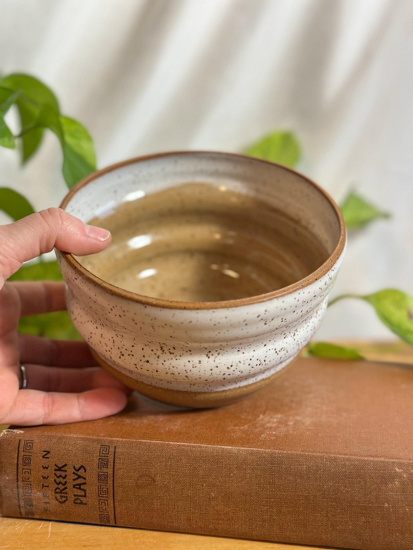 white and brown speckled modern soup bowls