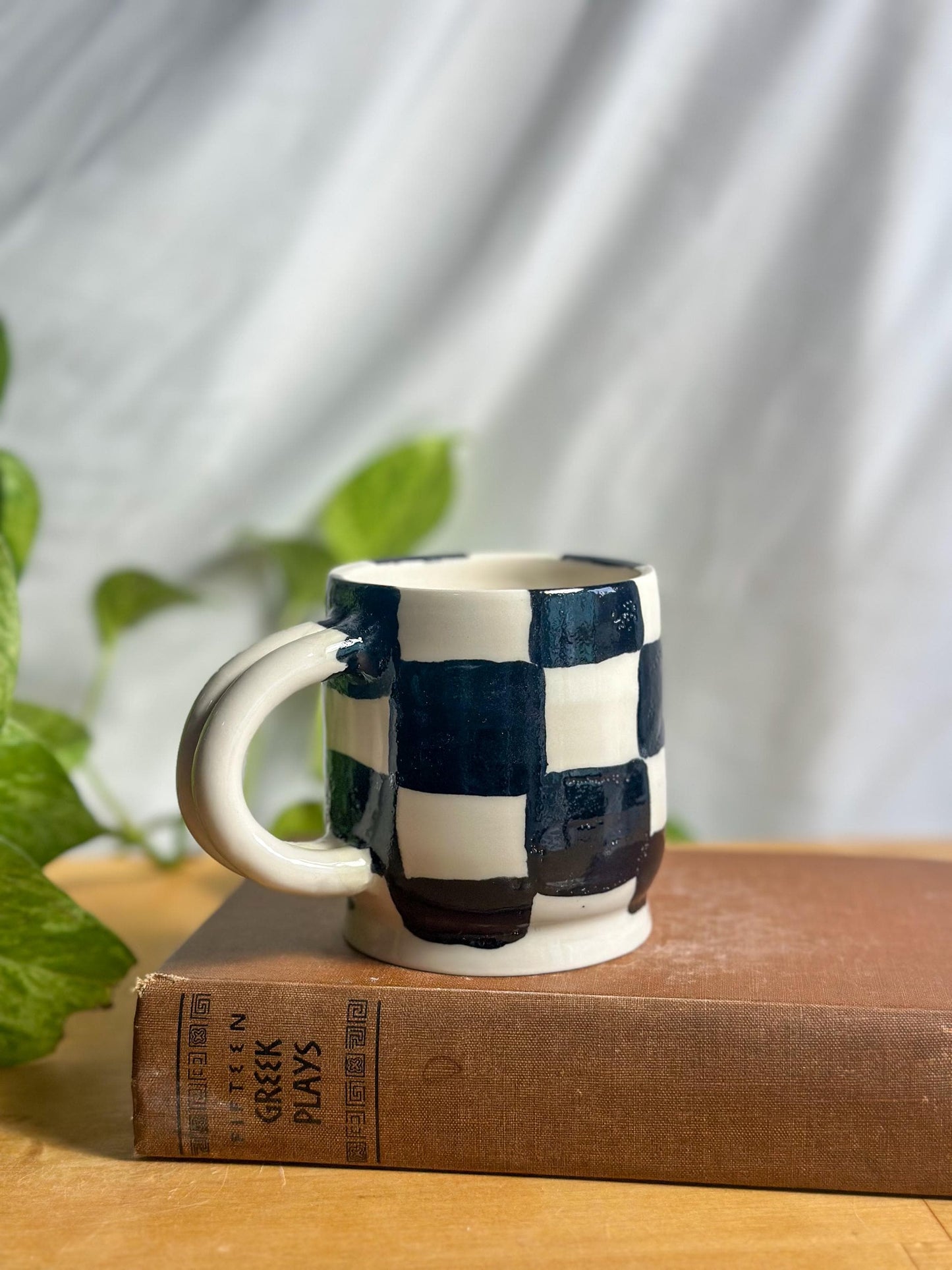 black and white checkered hand made pottery mug