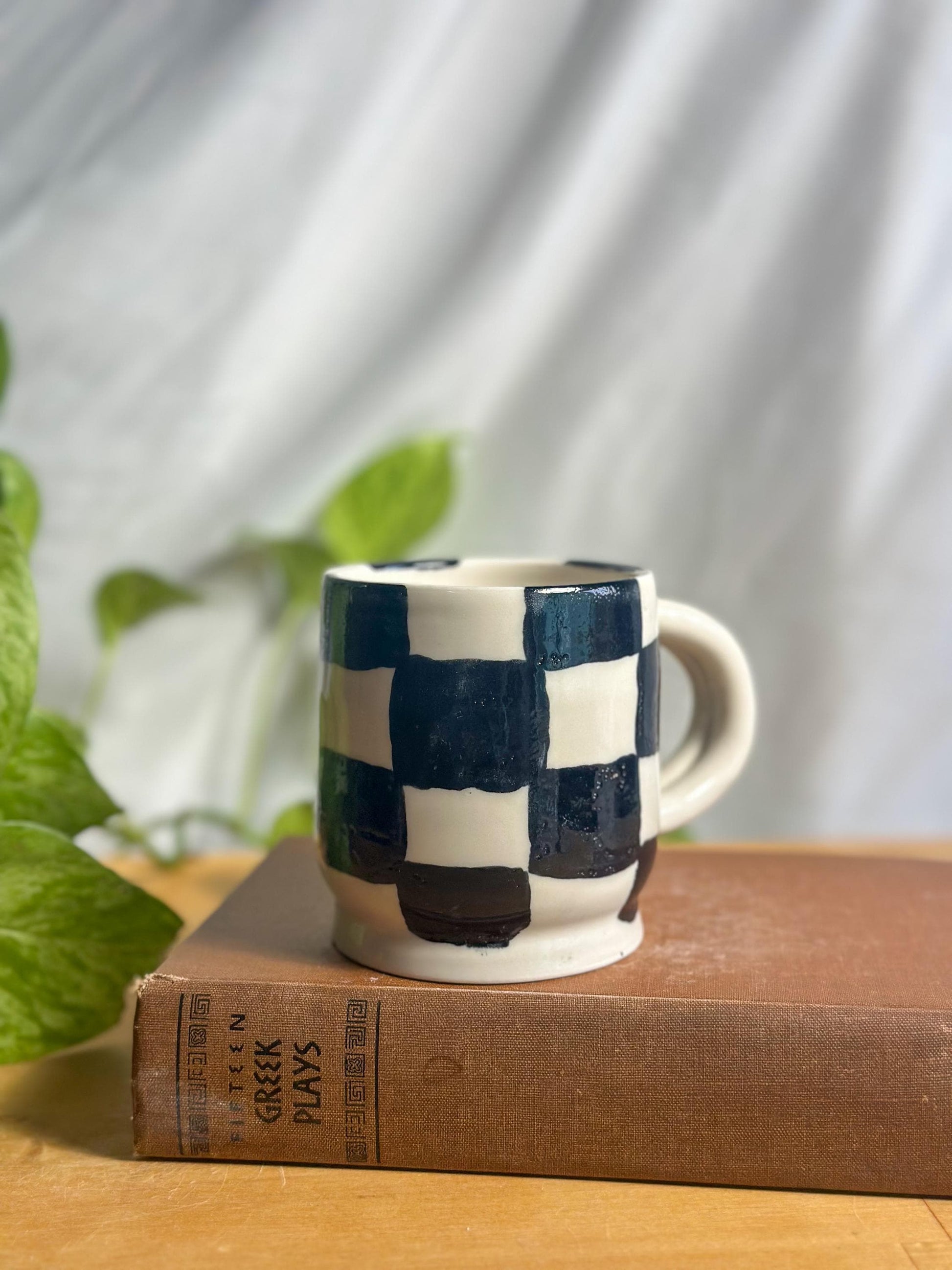 black and white checkered hand made pottery mug