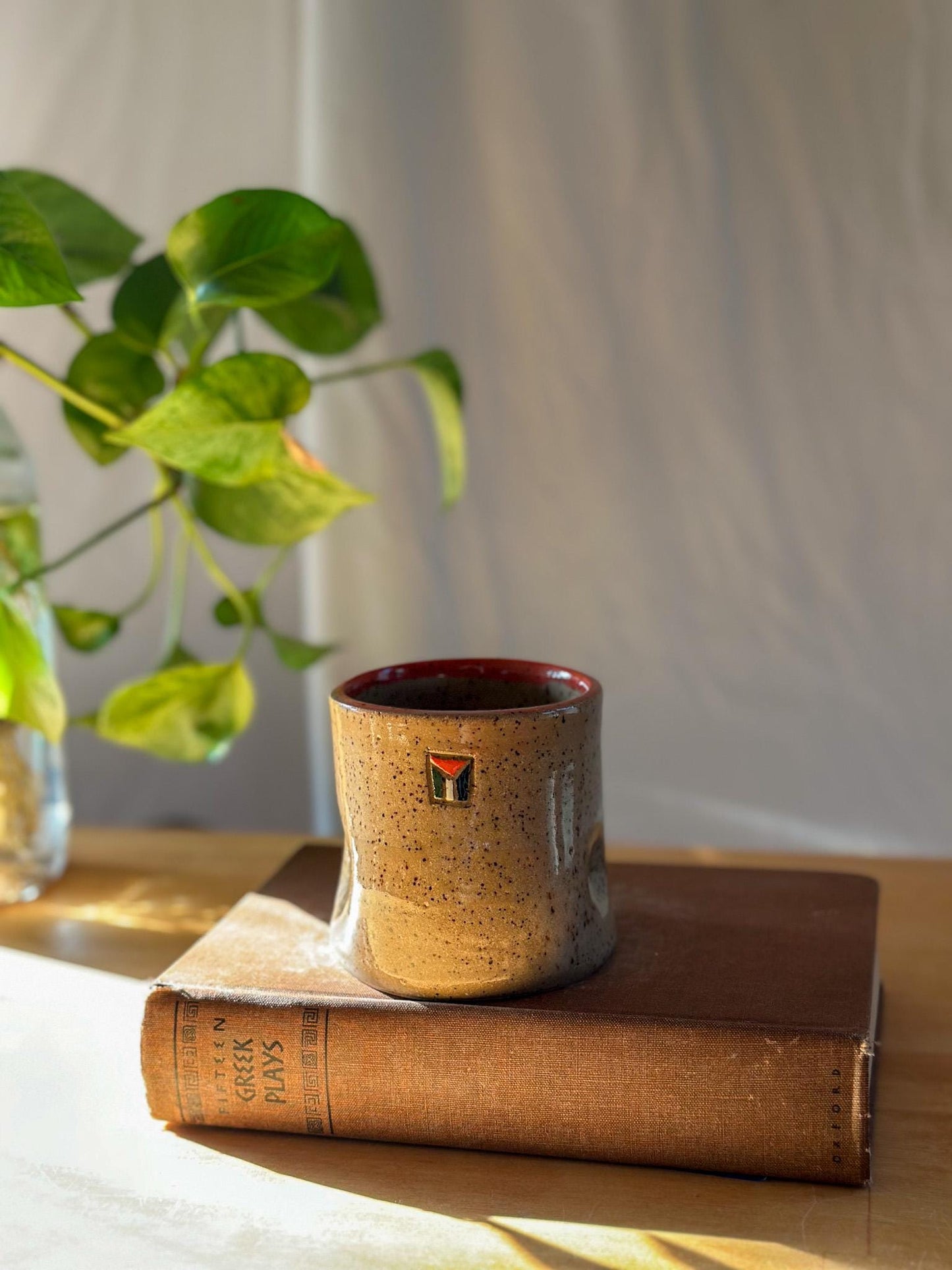 carved poppy flower free palestine ceramic thumb indent mug