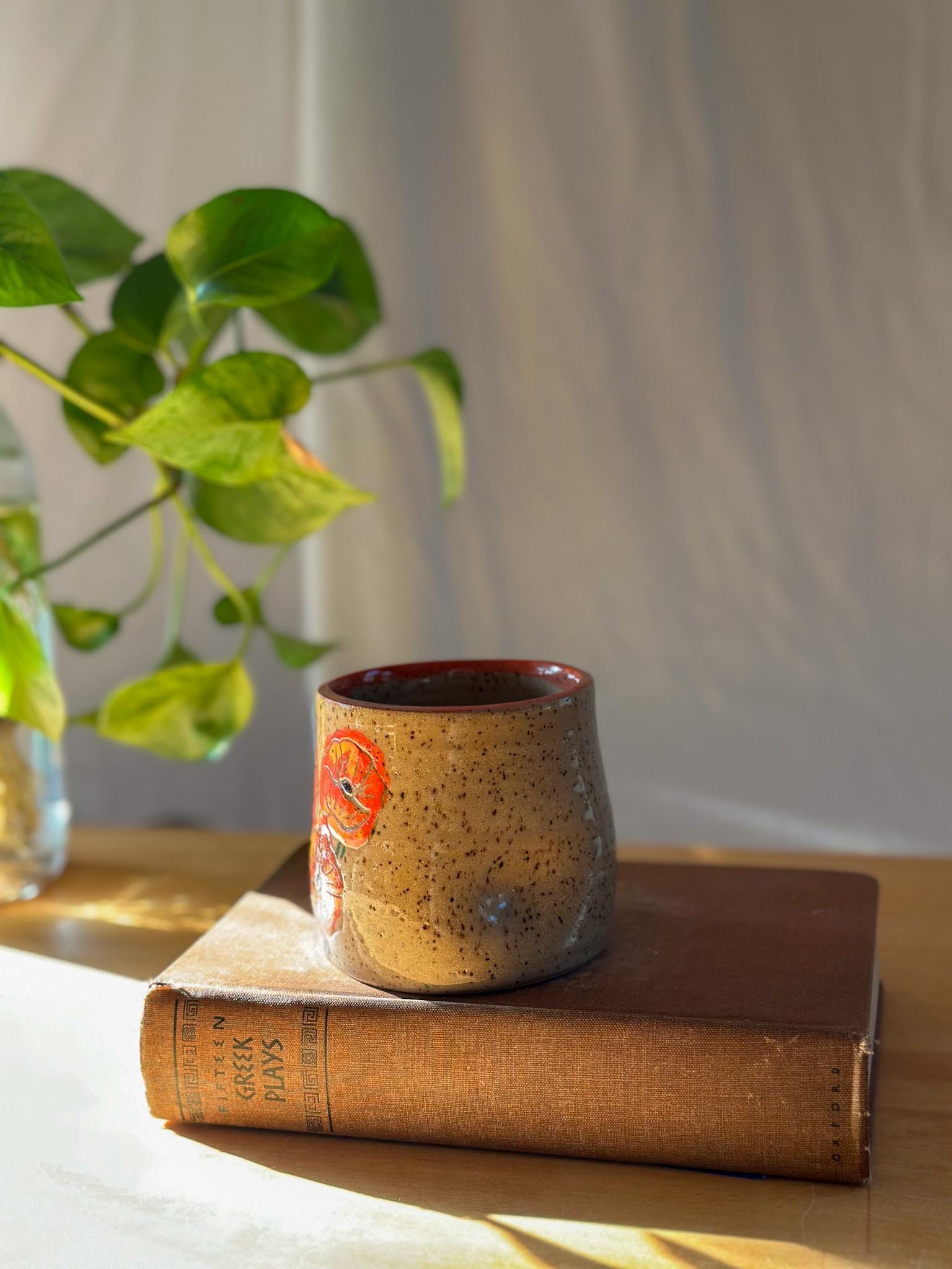 carved poppy flower free palestine ceramic thumb indent mug