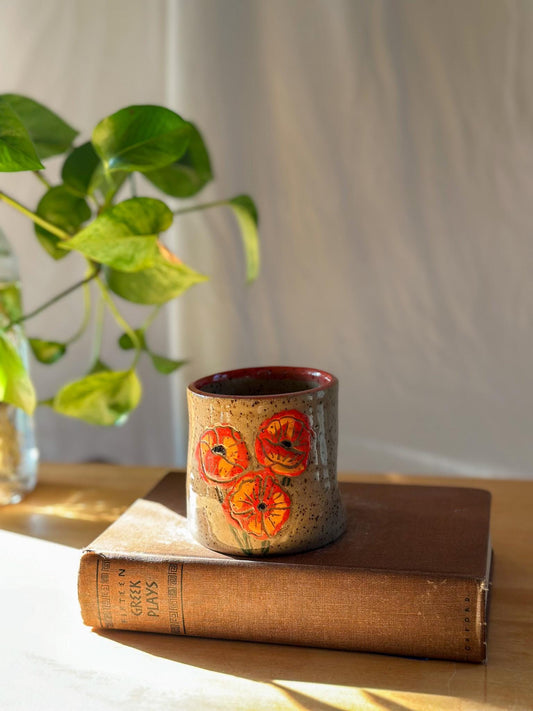 carved poppy flower free palestine ceramic thumb indent mug