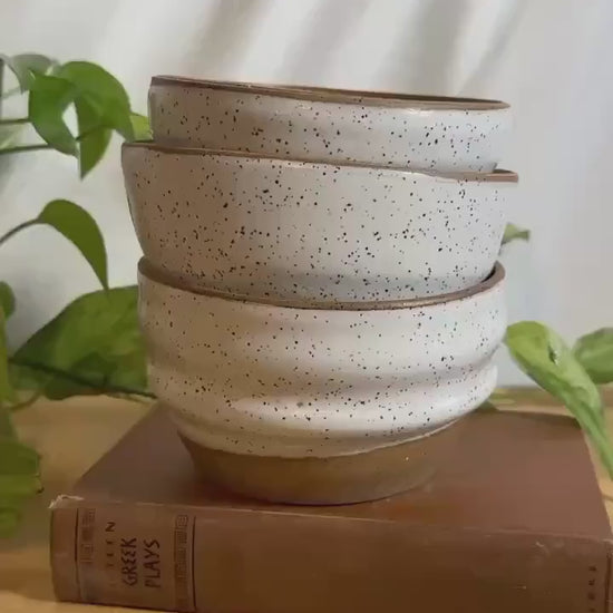 white and brown speckled modern soup bowls