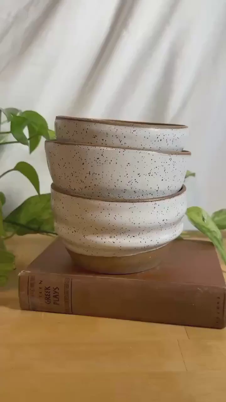 white and brown speckled modern soup bowls