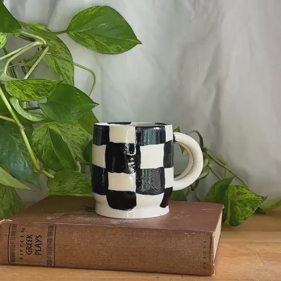 black and white checkered hand made pottery mug